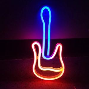 Detail of neon guitar sign with glowing orange and blue LED lights for wall decoration