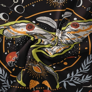 Detailed macro view of moth and mushroom print on soft pleated tapestry fabric
