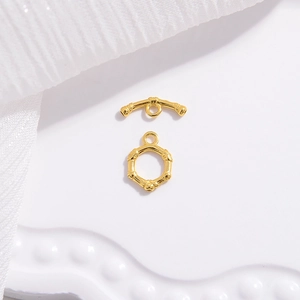Macro shot of gold-plated toggle clasp with bamboo texture for DIY jewelry making