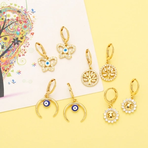 Detailed set of gold plated earrings featuring Tree of Life, Evil Eye and FE sunflower charms