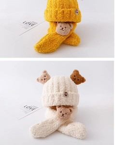 Detail of plush bear knit hat and scarf set for toddlers in yellow and cream
