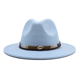 Detail of light blue wool fedora featuring a shell ornament and textured woven belt