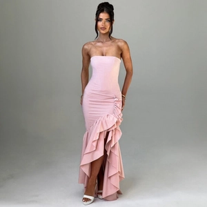 Detail of light pink strapless mermaid dress with ruffled layers and a high leg slit