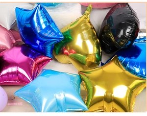 Detailed view of 10-inch star-shaped foil balloons in assorted glossy metallic colors