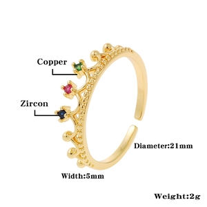 Detailed view of copper crown ring with colorful zircon stones and adjustable open band