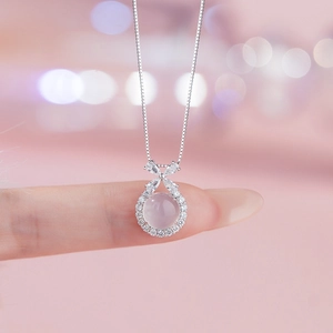 Elegant S925 silver necklace with pink agate pendant and sparkling butterfly knot detail