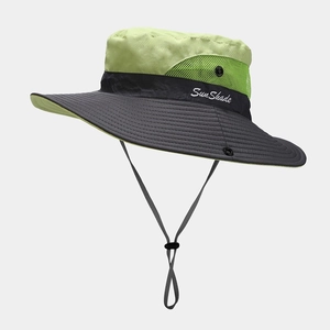 Detail of outdoor sun hat with green breathable mesh and wide grey brim for sun protection