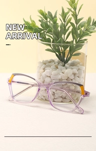 Detailed macro shot of translucent purple eyeglass frame with vibrant orange accents