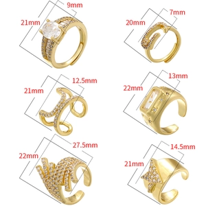 Set of six gold geometric adjustable open rings with sparkling gemstone inserts