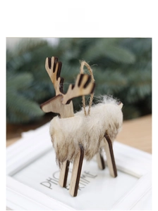 Close-up of wooden reindeer ornament with faux fur detail and natural jute rope hanger