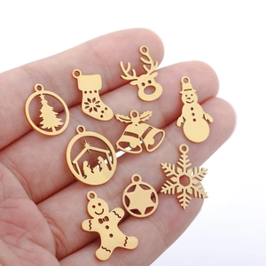 Set of 10 gold stainless steel Christmas charms on hand including snowman and deer