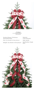 Detail of red and black buffalo plaid Christmas bow with reindeer pattern on tree