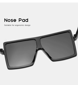 Close-up of ergonomic nose pads on stylish black square frame sunglasses for children