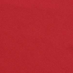 Close-up of red textured fabric showing the detailed weave of the halter bodysuit set