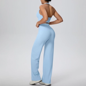 Detail view of the sky blue yoga set showing the open back halter top and flared pants