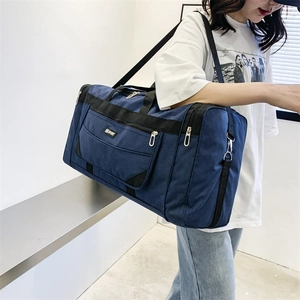 Large capacity waterproof navy nylon travel bag with shoulder strap and SPORT logo detail
