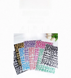 Detail of waterproof glitter letter and number stickers showing glossy texture and colors