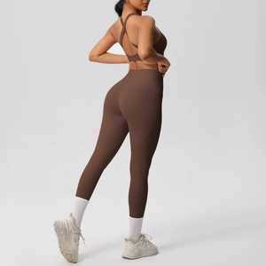Close-up of high-waist yoga leggings with side pocket and criss-cross back sports bra