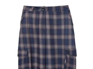 Detail of waist buttons and side cargo pockets on dark blue plaid trousers for women