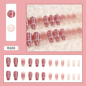 Detail view of R688 press-on nails featuring red plaid patterns and heart gradient designs