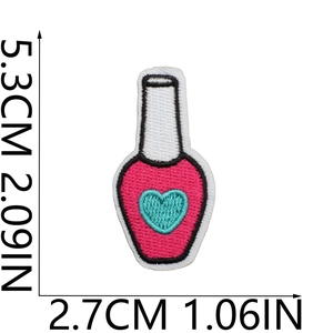 Detail view of a pink bottle embroidery patch with dimensions 5.3cm x 2.7cm