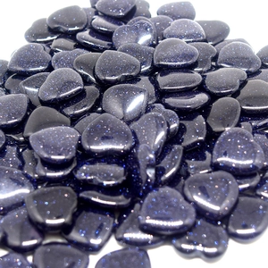 Close-up of sparkling blue sandstone heart-shaped stones with starry finish