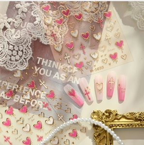 Detailed view of gold foil heart nail stickers M-1033 with crosses and calligraphy