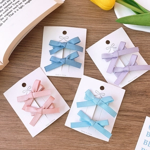 Set of 8 ballet style ribbon bow hair clips in navy blue, purple, pink, and light blue