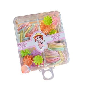 Kids hair accessory set with macaron color hair ties and flower clips in a storage box