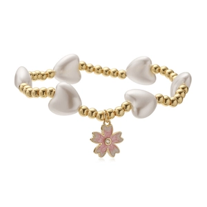 Golden bead bracelet with heart pearls and pink cherry blossom pendant on white background