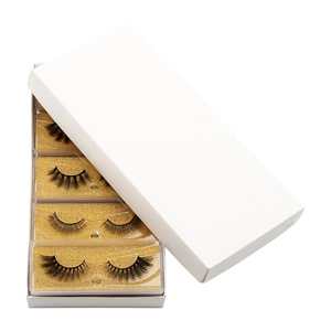Detail of 3D faux mink eyelashes packaging with gold glitter tray showing model numbers