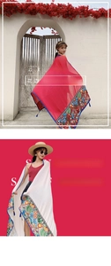 Detailed embroidery and fringe tassels on lightweight red and white ethnic linen scarves