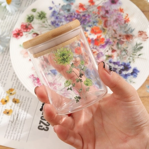 Waterproof ink floral stickers set on a glass jar with bamboo lid for DIY home decor