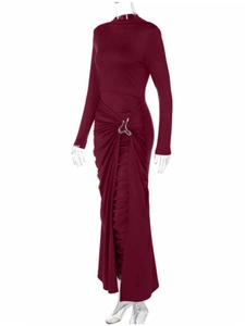 Detail of elegant dark red maxi dress showing side pleats and silver metal buckle accent
