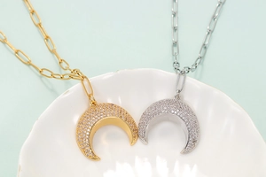 Elegant crescent moon necklaces in gold and silver with rhinestones and rectangular chains