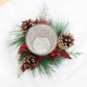 Christmas wreath candle holder with pine cones, red berries and buffalo plaid bow decoration