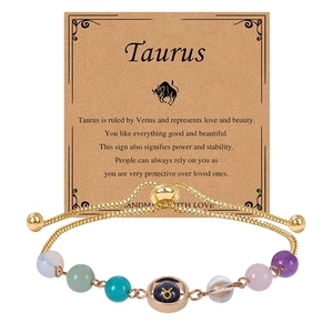 Detail of handmade Taurus constellation bracelet with blue sandstone and gold beads