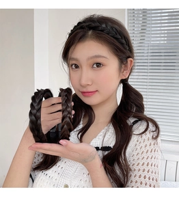 Close-up detail of dark brown synthetic hair braided headband showing intricate textures