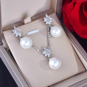 Elegant pearl and rhinestone jewelry set with necklace and earrings in a luxury gift box