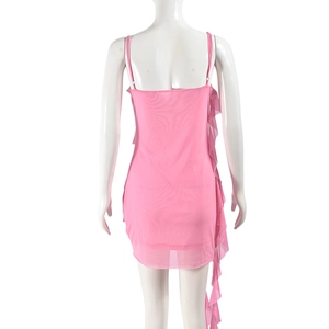 Detail view of pink mesh mini dress featuring ruffled hem and backless design on a mannequin