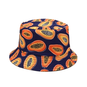 Double-sided navy bucket hat with orange papaya fruit prints for sun protection