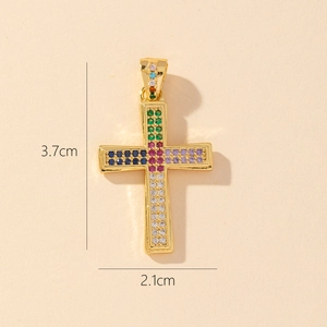 Detailed view of gold plated cross pendant with multicolored zircons measuring 3.7x2.1cm