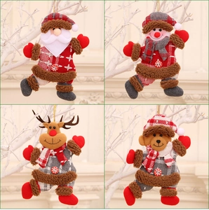 Close-up of plush Santa, Snowman, Reindeer, and Bear ornaments for Christmas tree decor