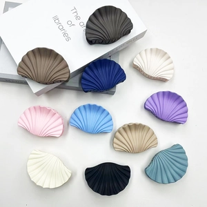 Detailed flat lay of 10-color matte shell hair clips with elegant marble textures