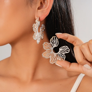 Chic silver hollow flower earrings for women featuring minimalist metal petal design