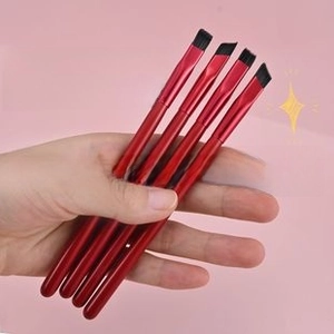 Set of four professional angled eyebrow brushes with metallic wine red handles