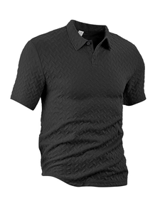 Detailed view of the textured herringbone knit fabric on a black men's short-sleeve Polo shirt