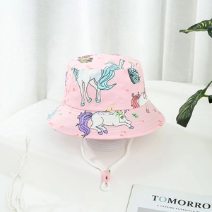 Pink kids sun hat with unicorn prints and adjustable chin strap on a white stand