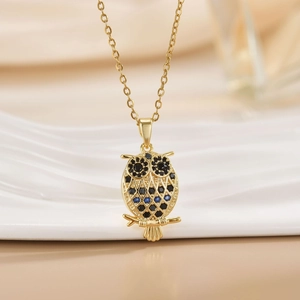 Elegant 18K gold plated owl necklace featuring hollow design and sparkling blue gemstones