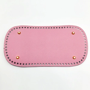 Pink oval PU leather bag base with pre-drilled holes and four gold metal feet